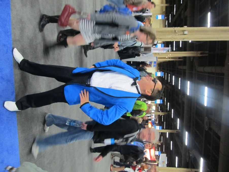 Dux Raymond Sy performing "Gangnam Style" on the expo floor